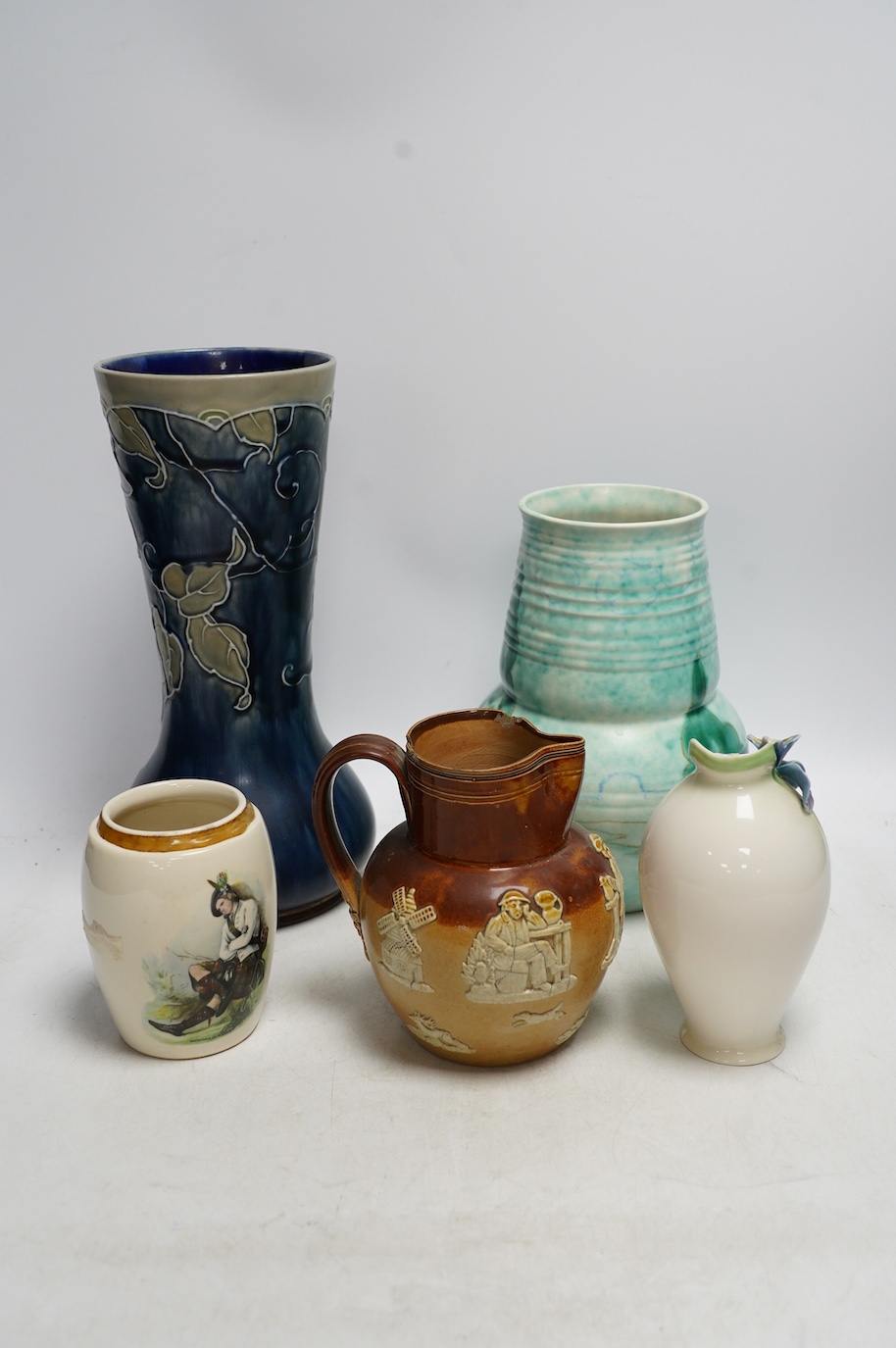 A Doulton Lambeth stoneware vase, a G.M. For Beswick vase, a Franz vase, a James Nicoll & Son and a Doulton stoneware jug, tallest 27cm. Condition - chips to Doulton